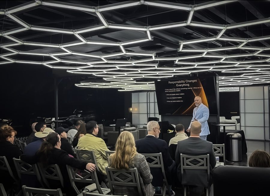 Princeton Clark teaching under hexagonal lighting